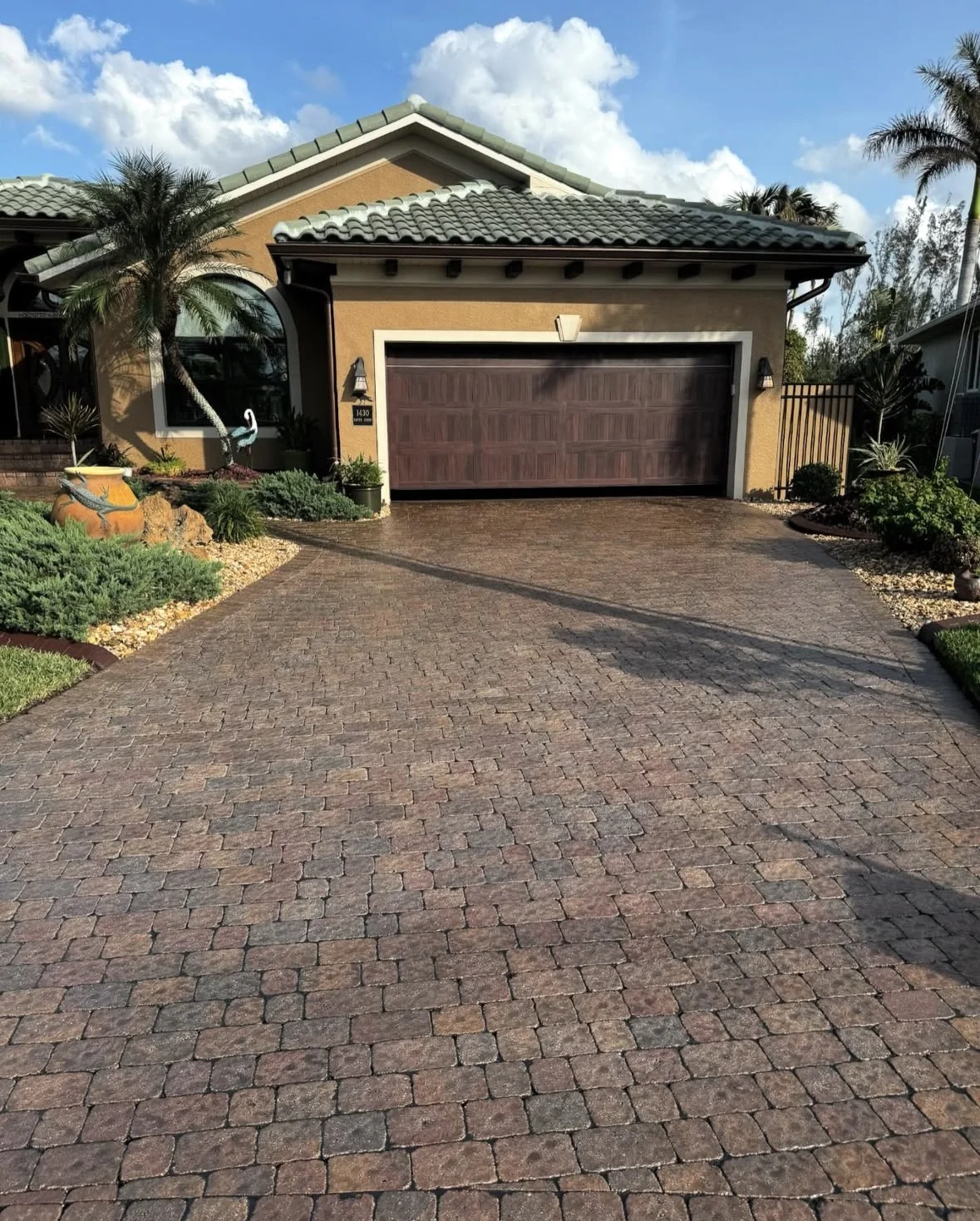 After: restored paver driveway completed by APS